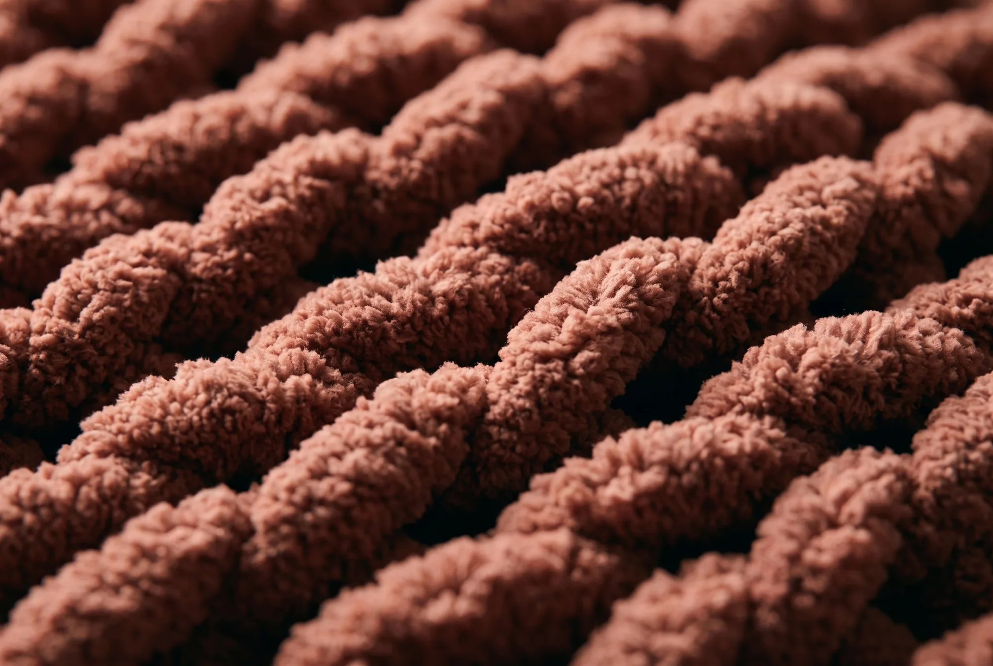 A macro view of the chenille cable, the cut pile catching the light.
